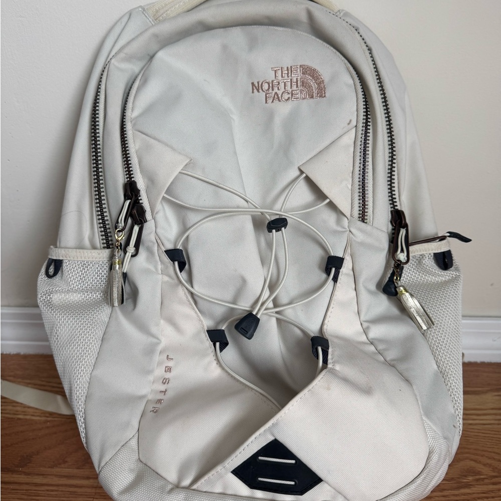 The North Face White Backpack with Padded Straps and Top Handle
